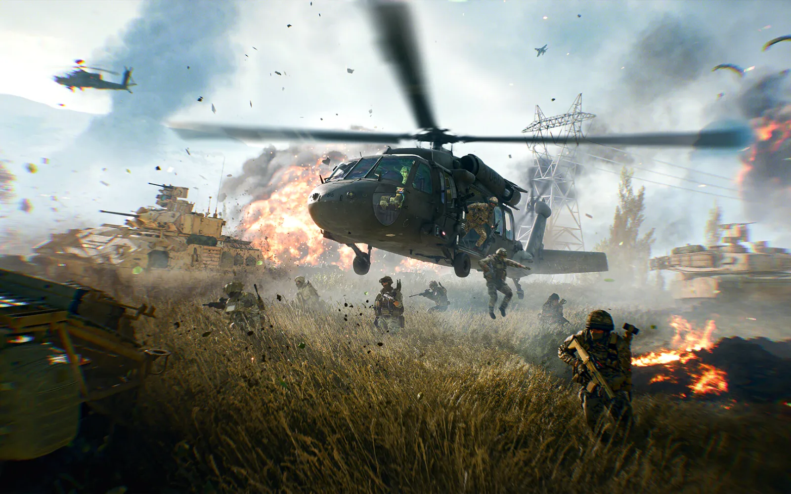 A helicopter drops soldiers in the middle of a tank battle