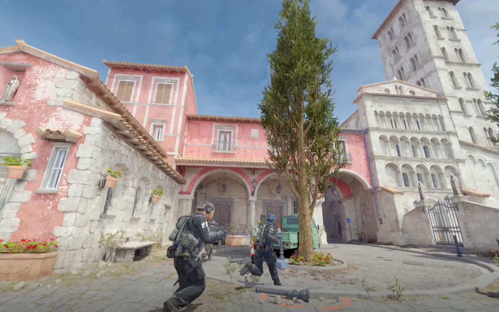A firefight in a courtyard on an Italian-style map, Counter-Strike 2