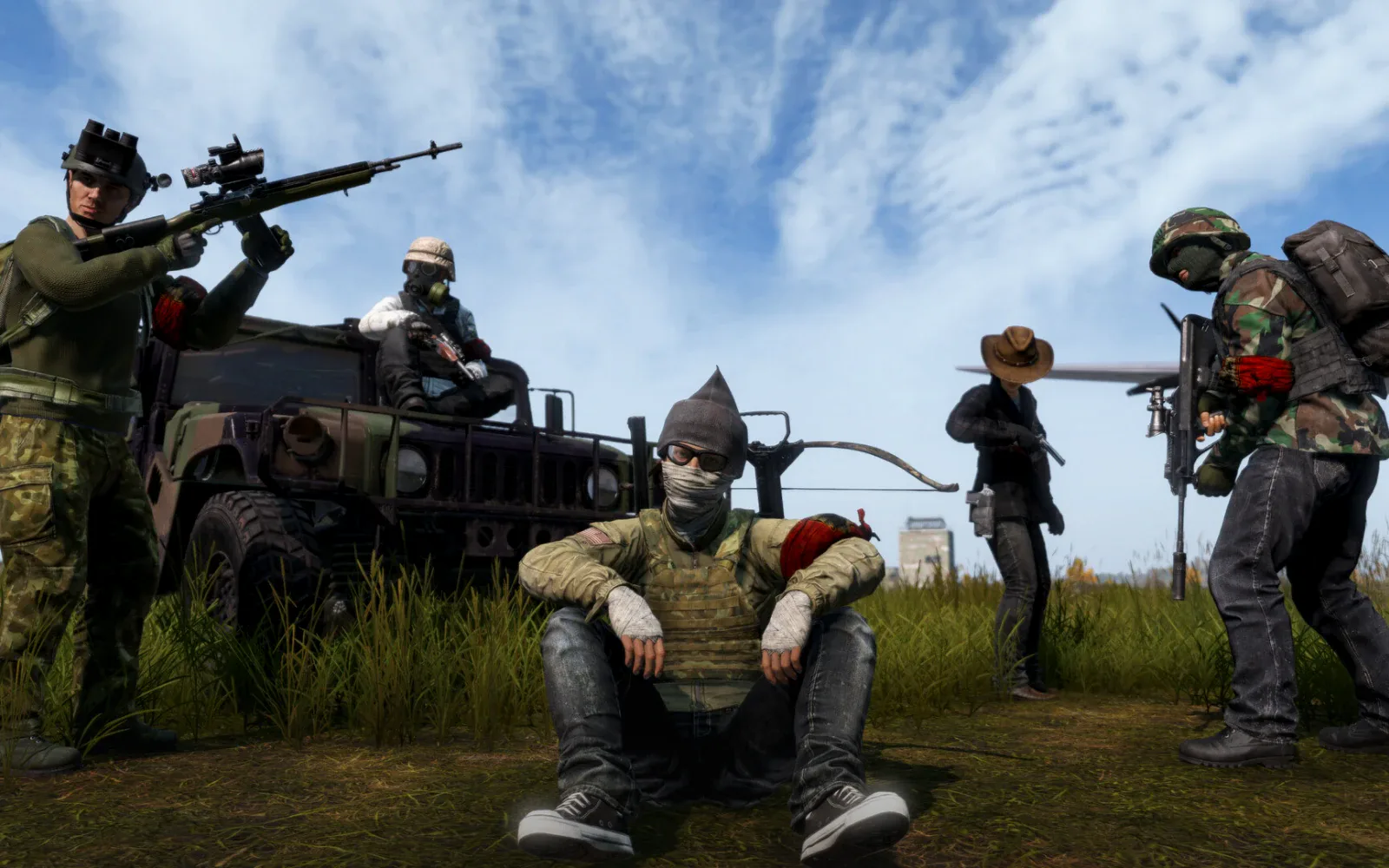 A group of survivors by a military vehicle in DayZ